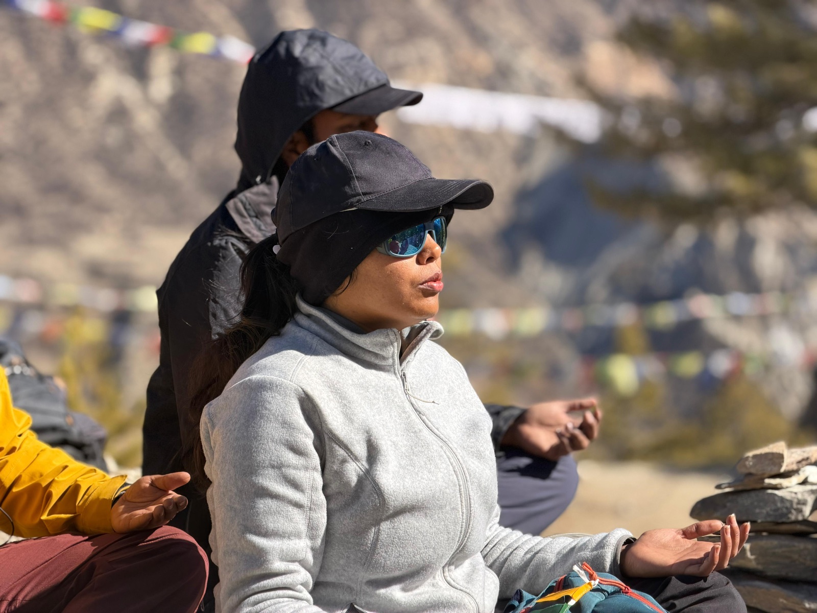 Practitioners in a communal yoga class — movement and stillness together