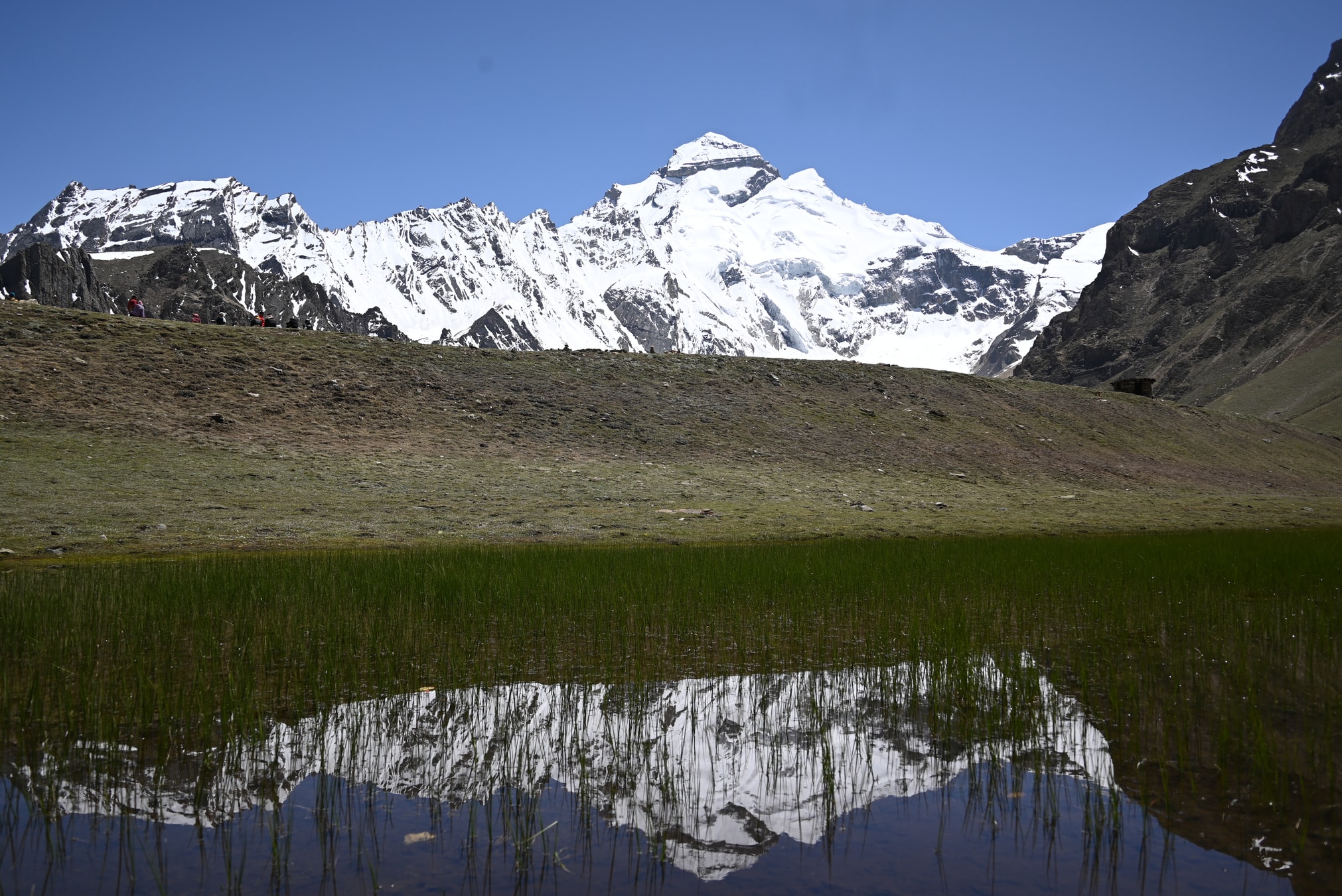 Wide view of snow-capped Adi Kailash rising above the Himalayan valley